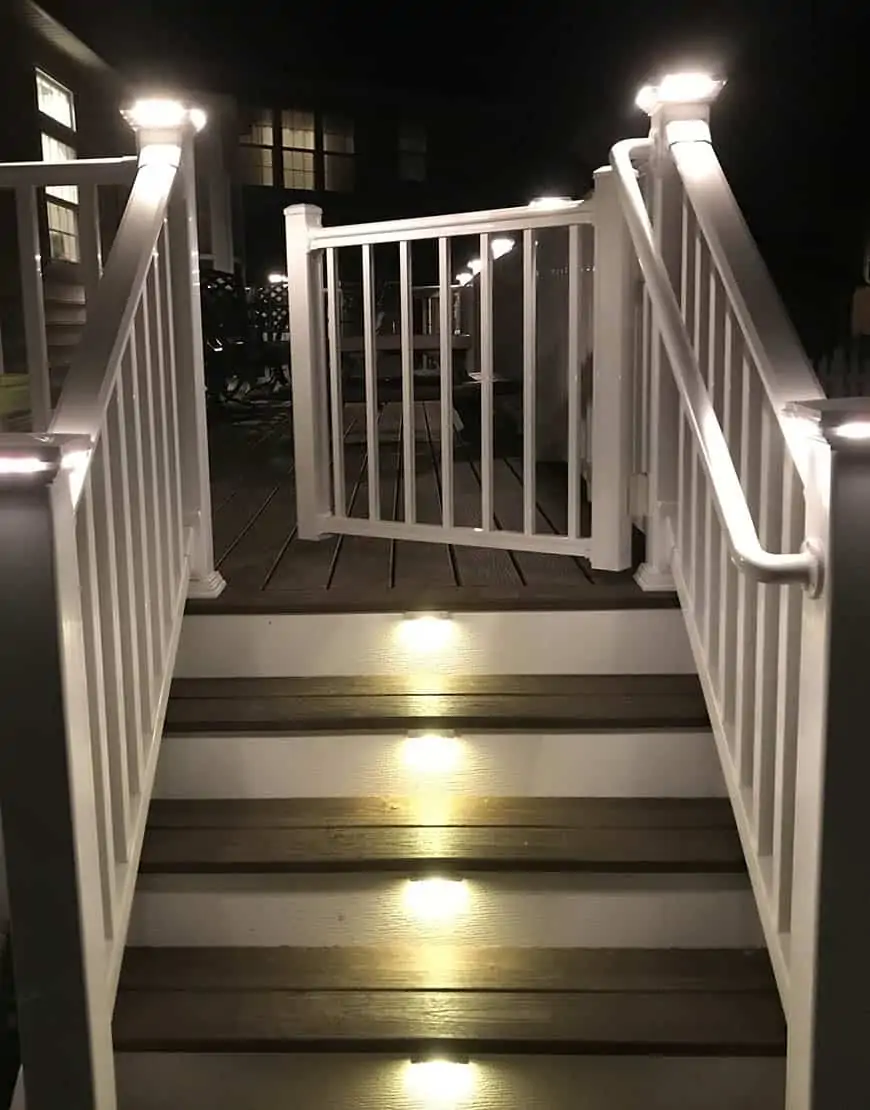 https://www.tru-post.com/wp-content/uploads/2023/02/tru-scapes-deck-fence-lighting-ts-a501-3-recessed-LED-step-riser-steps-deck-3-lights-white-stairs.webp